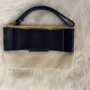 Navy and white leather Kate Spade wristlet with bow